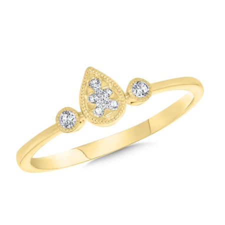 Diamond ring with side stones and pear-shaped diamond cluster center on white background