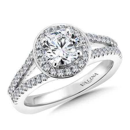 A gorgeous 14k white gold round halo diamond engagement ring with a split shank design.