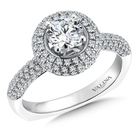 Three bands of diamonds surround the center in this beautiful halo-style diamond engagement ring.