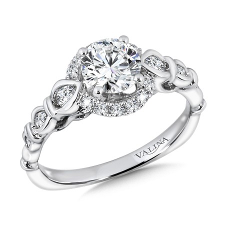 Round center halo engagement ring set in 14k white gold.