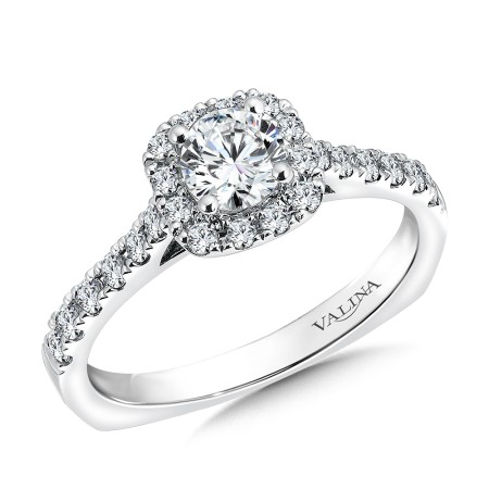 Halo-style diamond engagement ring set in 14k white gold.