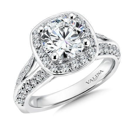 Cushion-shaped diamond halo engagement ring.