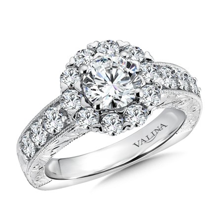 Hand engraved round halo diamond engagement ring set in 14k white gold.