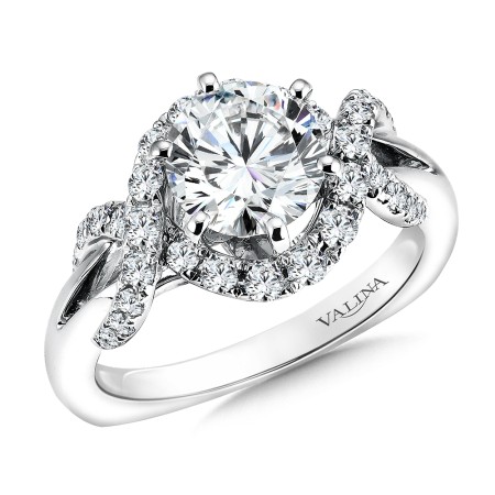 Round halo-style diamond engagement ring set in 14k white gold.